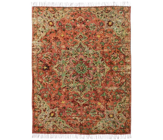 Handgemaakt plaid Julie van Imbarro met speels, kleurrijk dessin en kwastjes, zacht en cosy woonaccessoire voor een warme en stijlvolle zithoek.